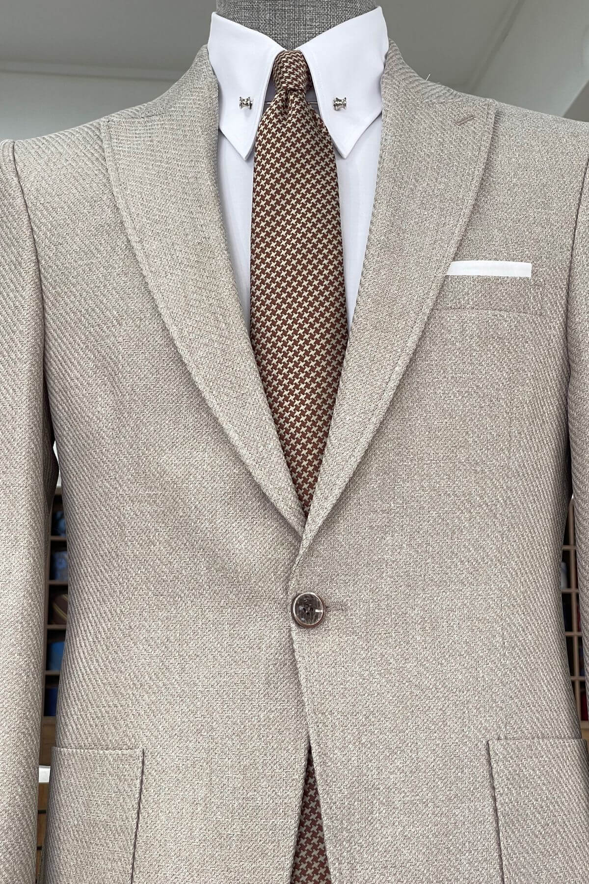 Slim-fit Wool Blend Self-Patterned Blazer in Beige with a white shirt and patterned tie on a mannequin.