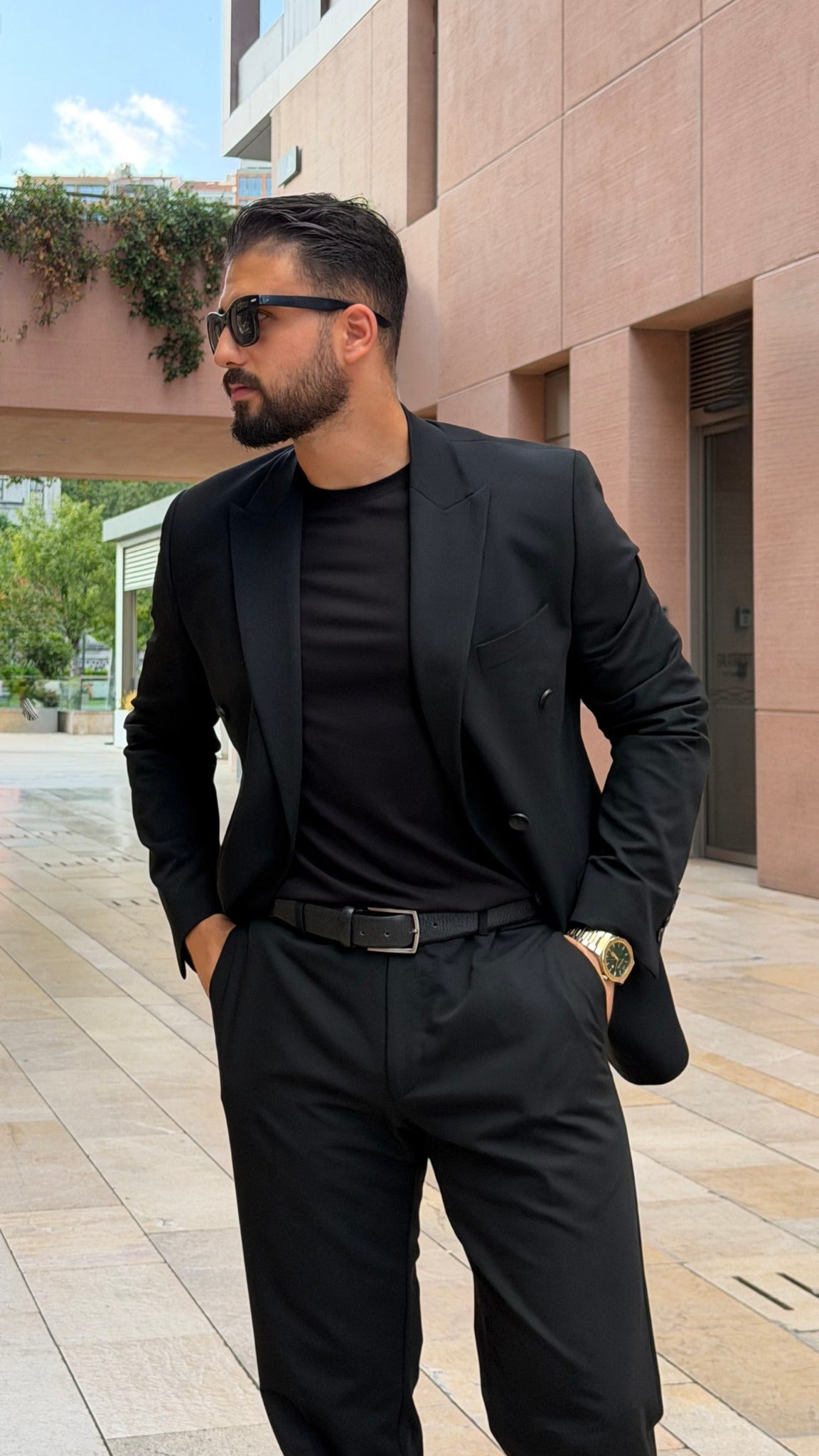 Black double-breasted suit peak lapel and tailoring detail