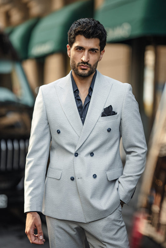 Close-up details of the premium blue double-breasted suit fabric