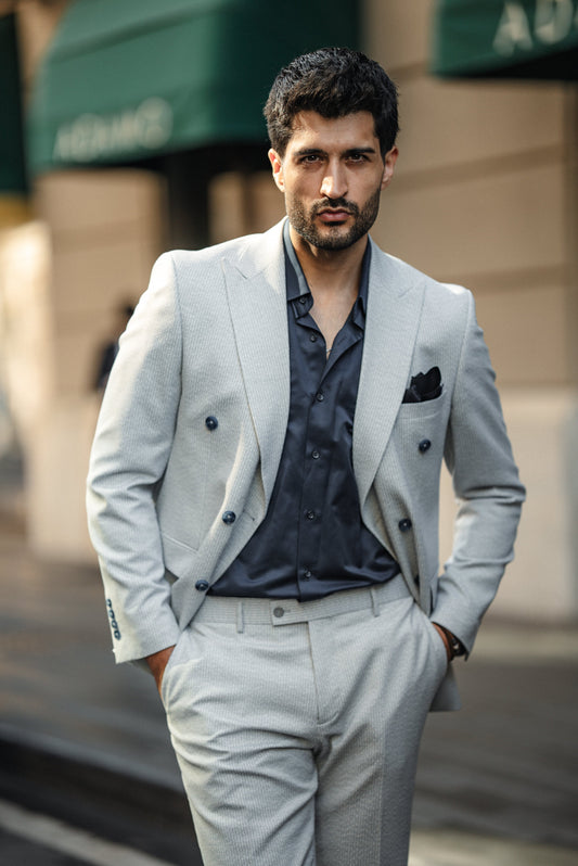 Blue tailored suit with notched lapels and modern fit