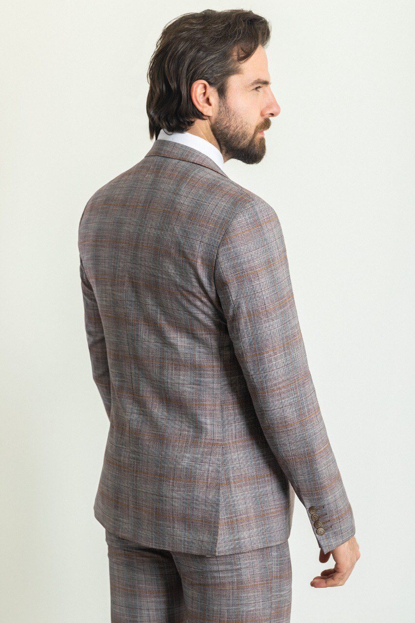 Man wearing a Gray Orange 3-Piece Suit with an orange tie, showcasing elegance and style.