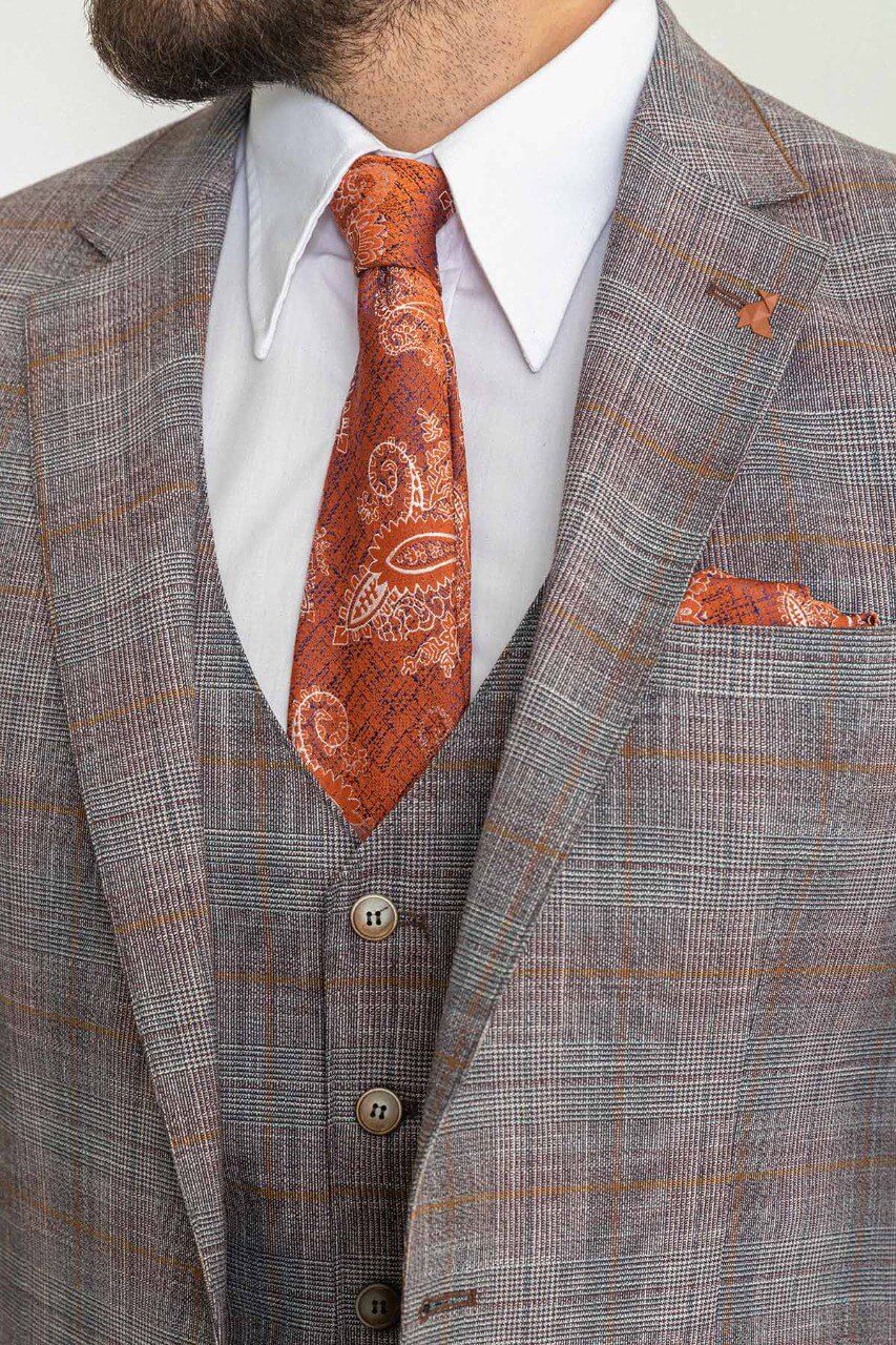 Man wearing a Gray Orange 3-Piece Suit with an orange tie, showcasing elegance and style.