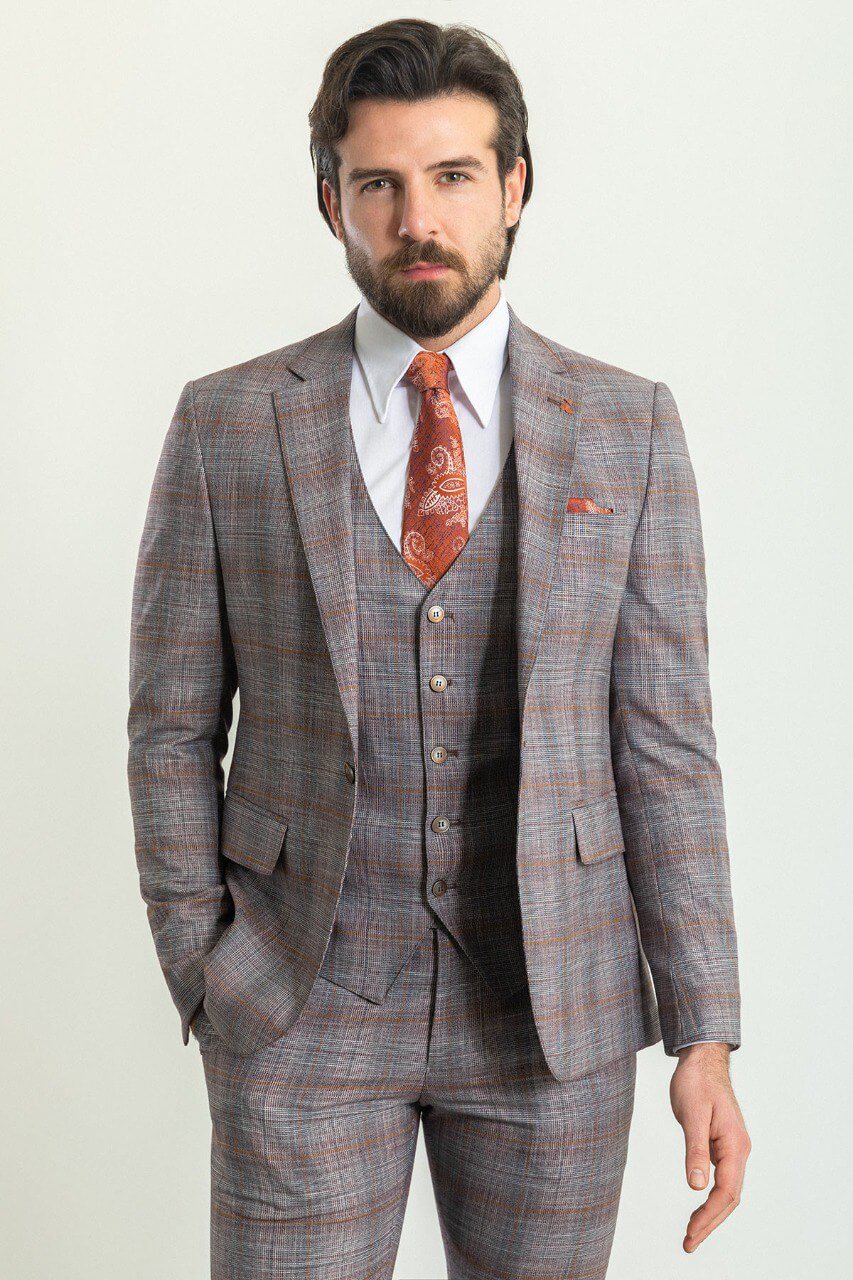 Man wearing a Gray Orange 3-Piece Suit with an orange tie, showcasing elegance and style.