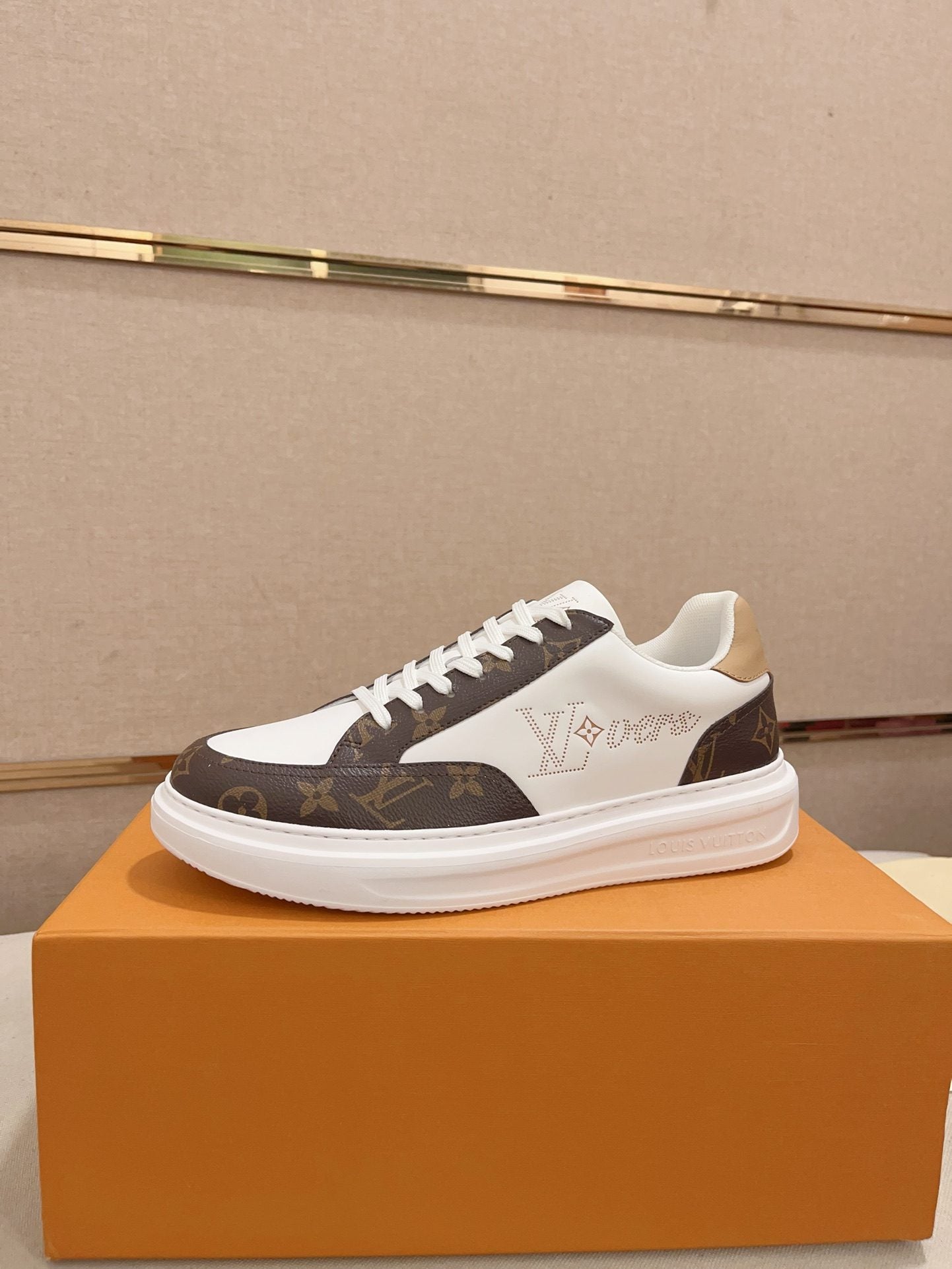 Louis Vuitton brown and white Monogram low-top sneakers side profile