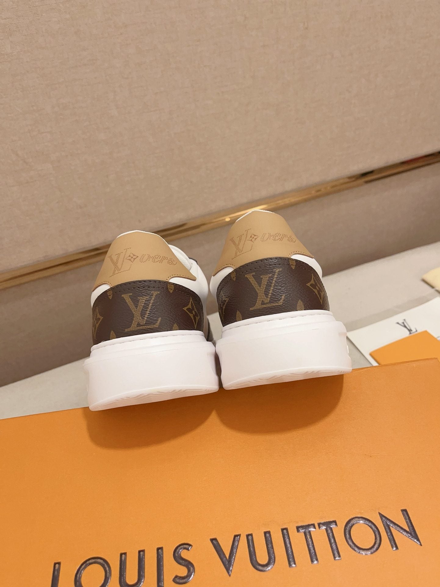 Louis Vuitton brown and white Monogram low-top sneakers rear heel view