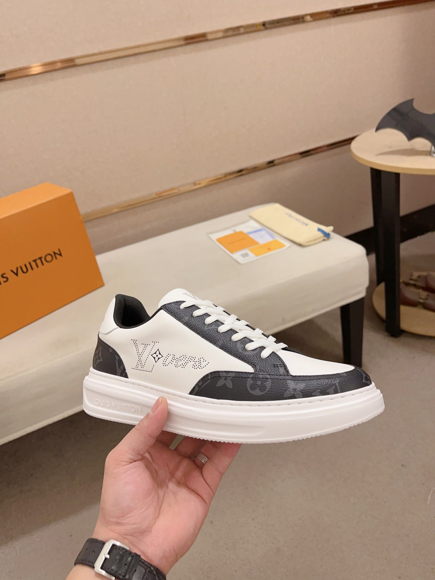 Louis Vuitton LVovers black and white Monogram low-top sneakers angled side view