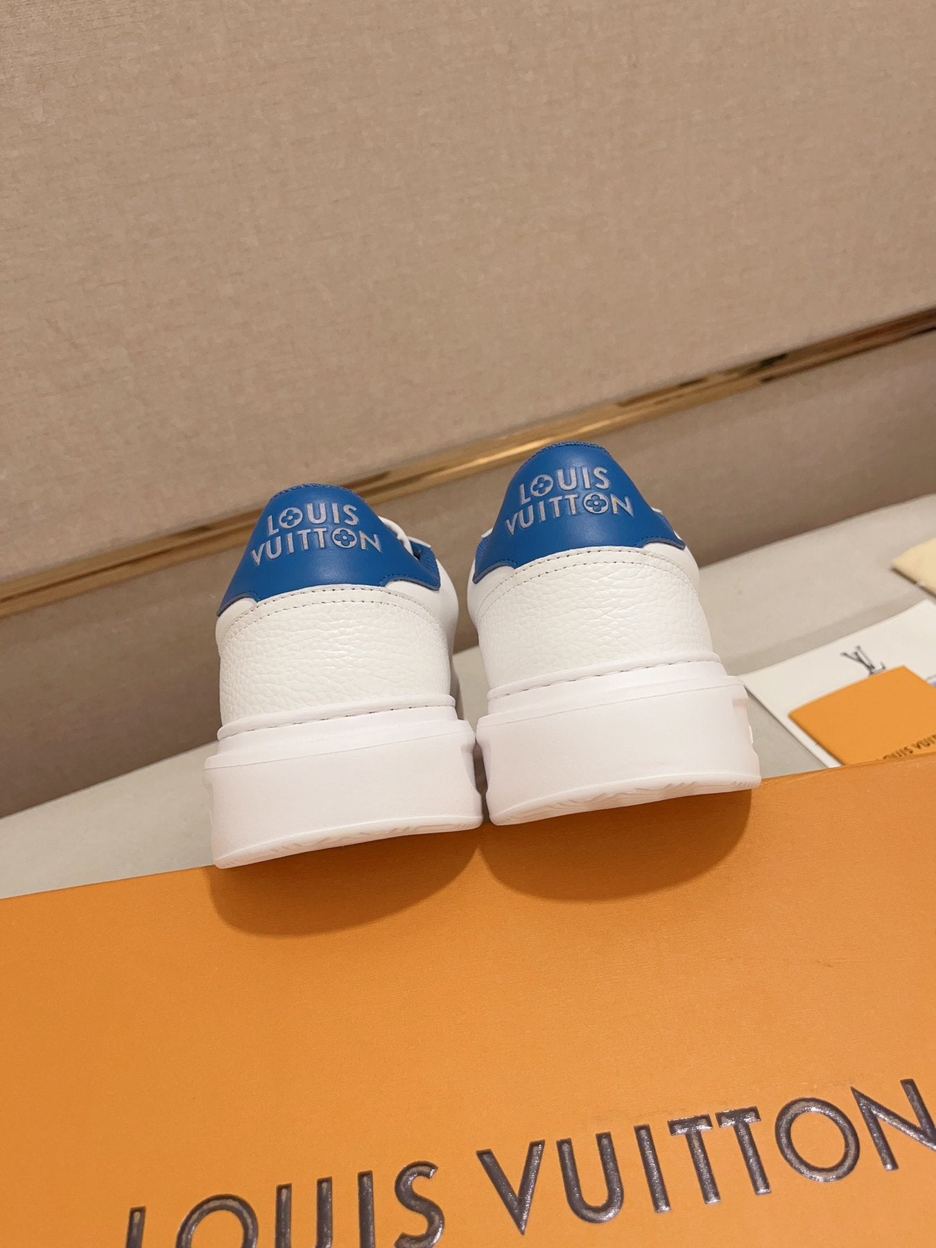 Louis Vuitton white and blue logo low-top sneakers rear heel view