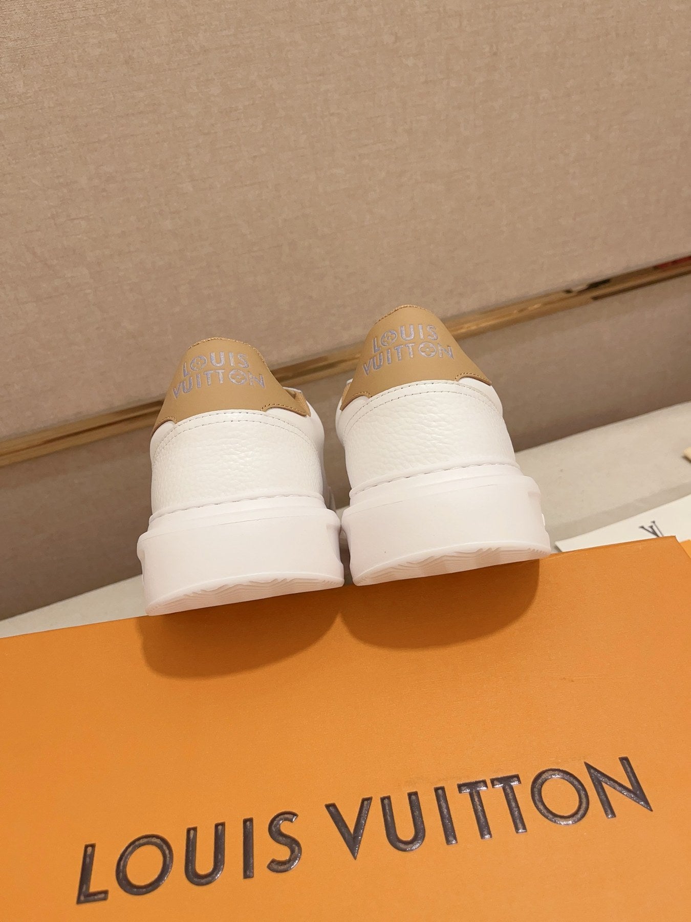Louis Vuitton white and tan logo low-top sneakers rear heel view