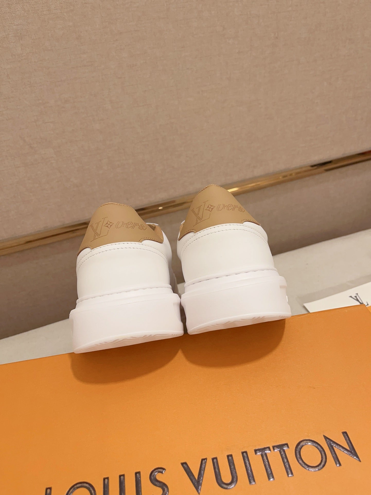 Louis Vuitton white and tan perforated LV low-top sneakers rear heel view