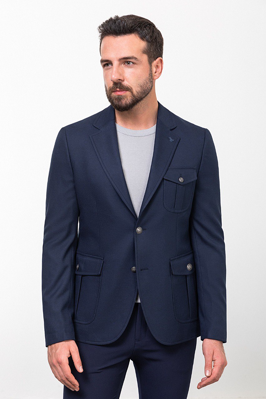 Man wearing a navy blue blazer with a light grey shirt, perfect for a smart-casual or business outfit.