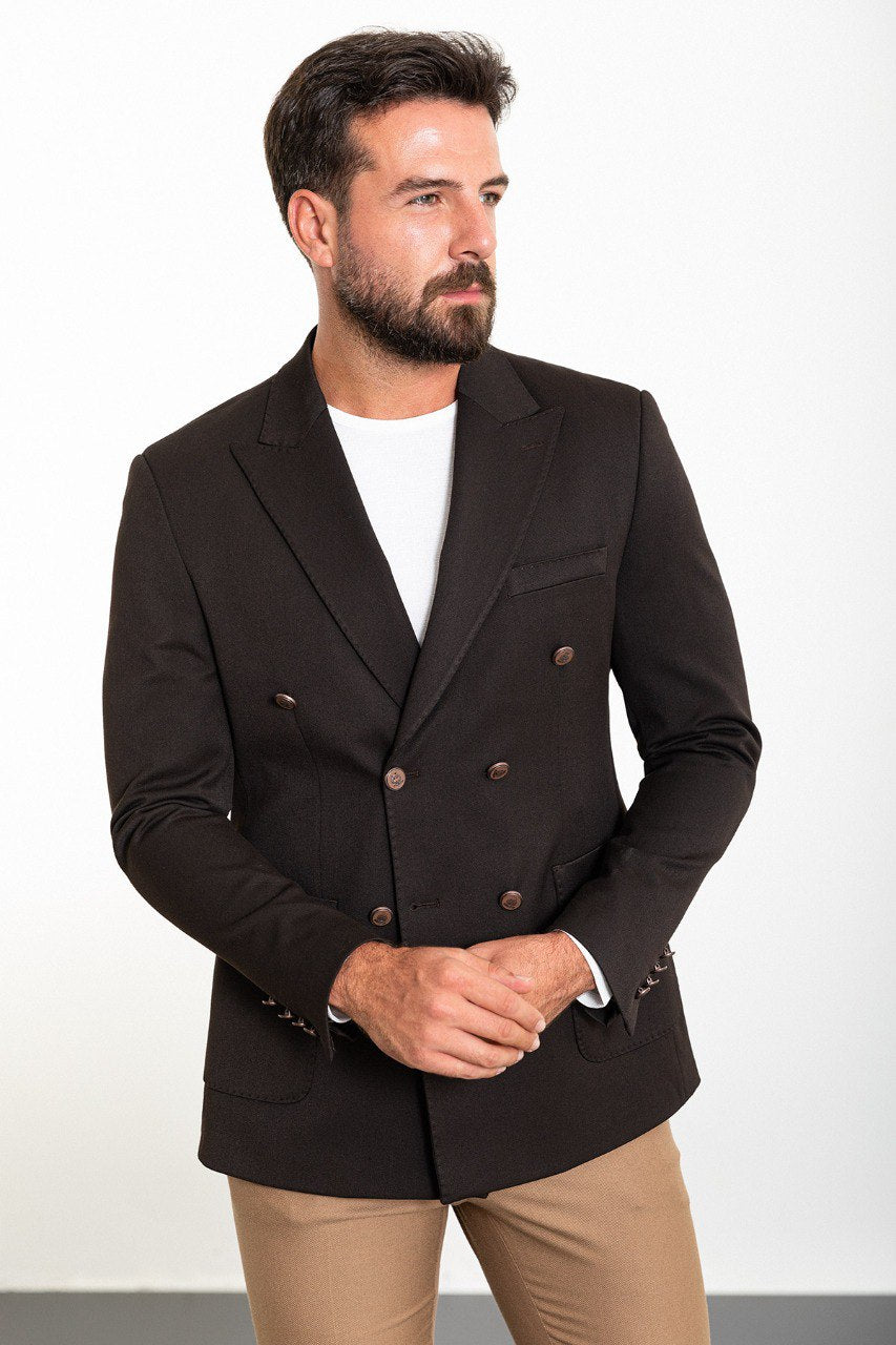 Man wearing a brown double-breasted blazer paired with beige trousers, showcasing a modern and elegant business-casual look.