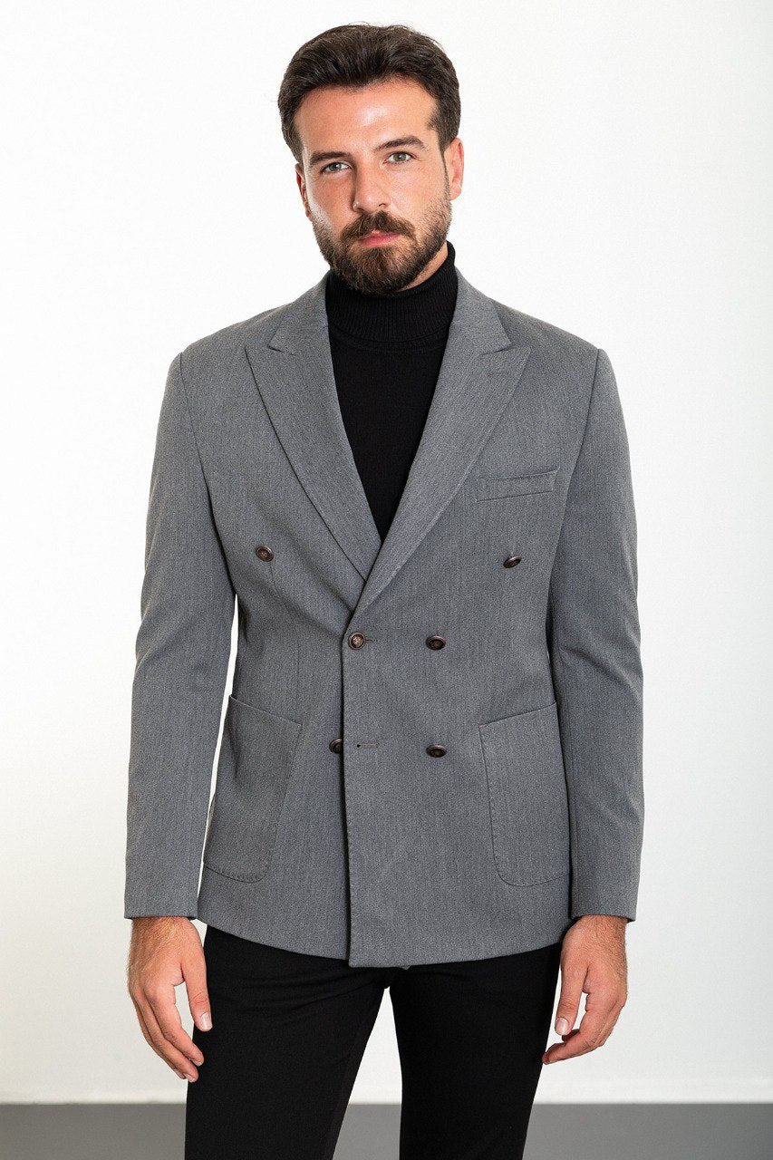 Man wearing a grey double-breasted blazer paired with a black turtleneck, ideal for smart-casual and formal occasions.