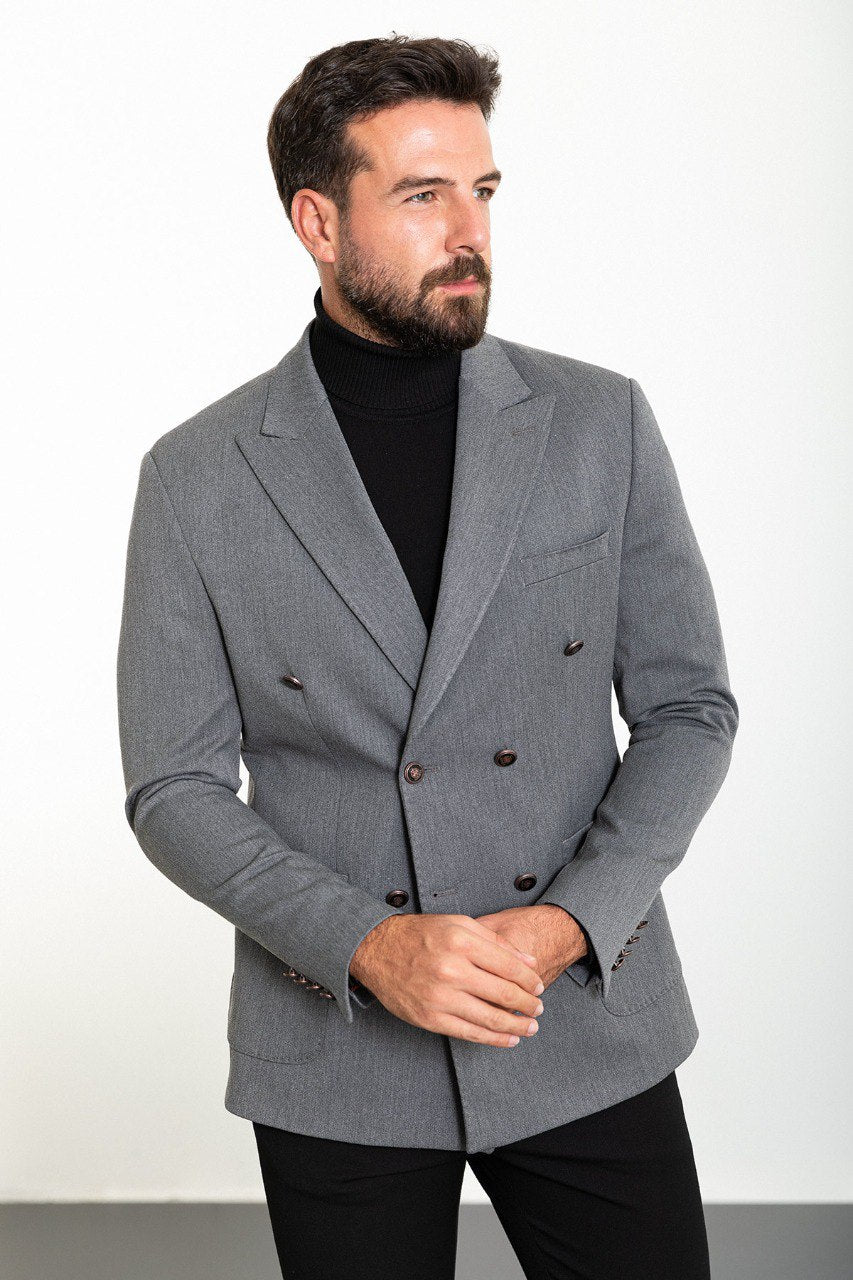 Man wearing a grey double-breasted blazer paired with a black turtleneck, ideal for smart-casual and formal occasions.