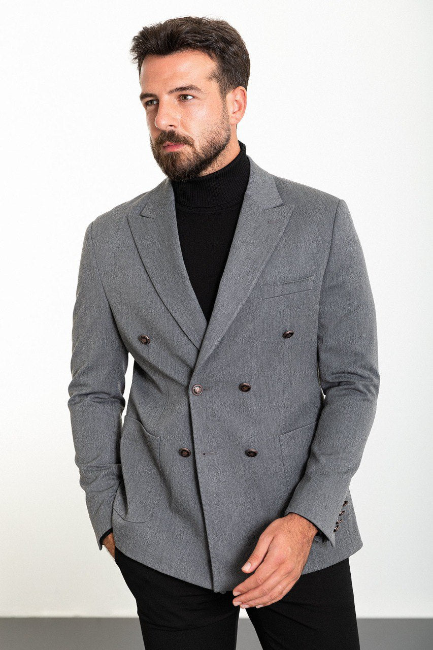 Man wearing a grey double-breasted blazer paired with a black turtleneck, ideal for smart-casual and formal occasions.