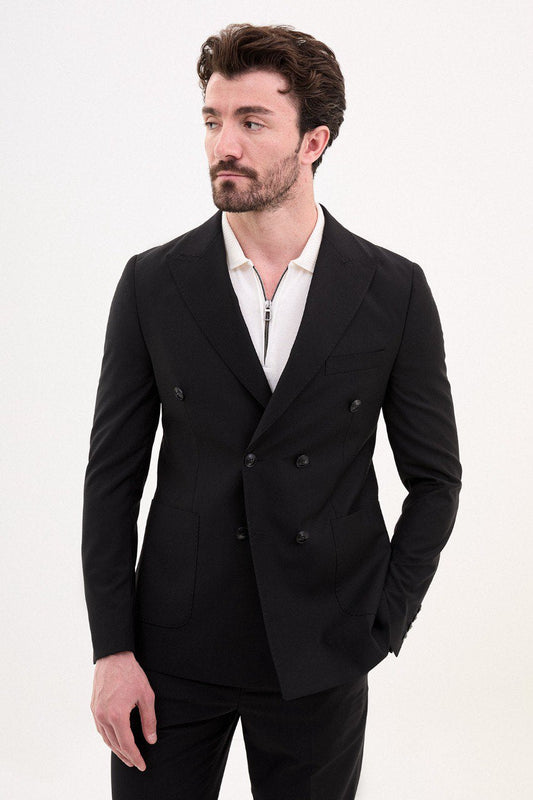 Man wearing a black double-breasted suit.