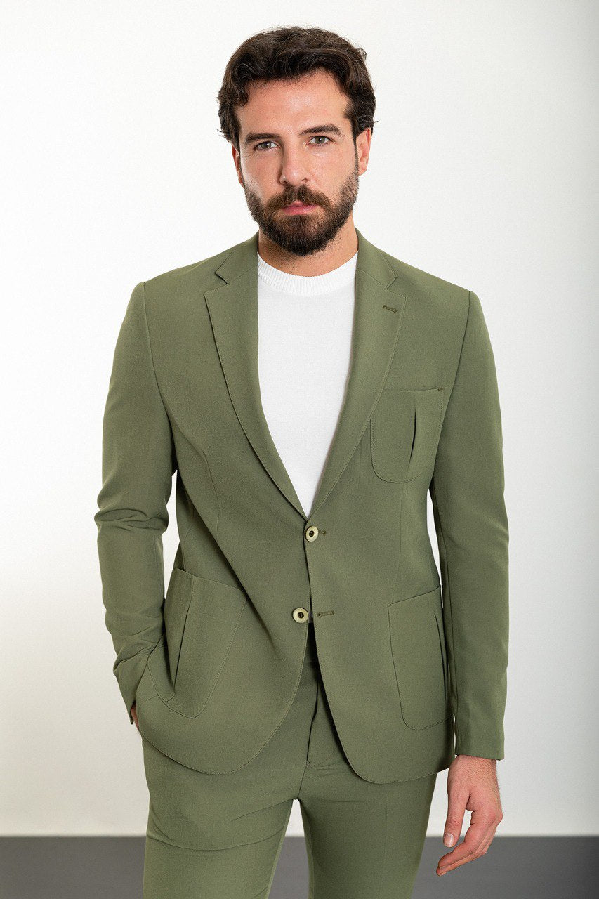 Man wearing the Urban Adventurer Khaki Suit, a slim fit khaki suit with extra pockets, ideal for casual and semi-formal occasions.