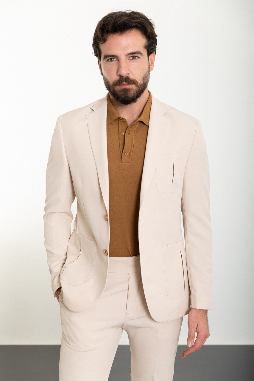 Man wearing the Urban Elegance Beige Suit, a slim fit beige suit with extra pockets, suitable for casual and semi-formal occasions.