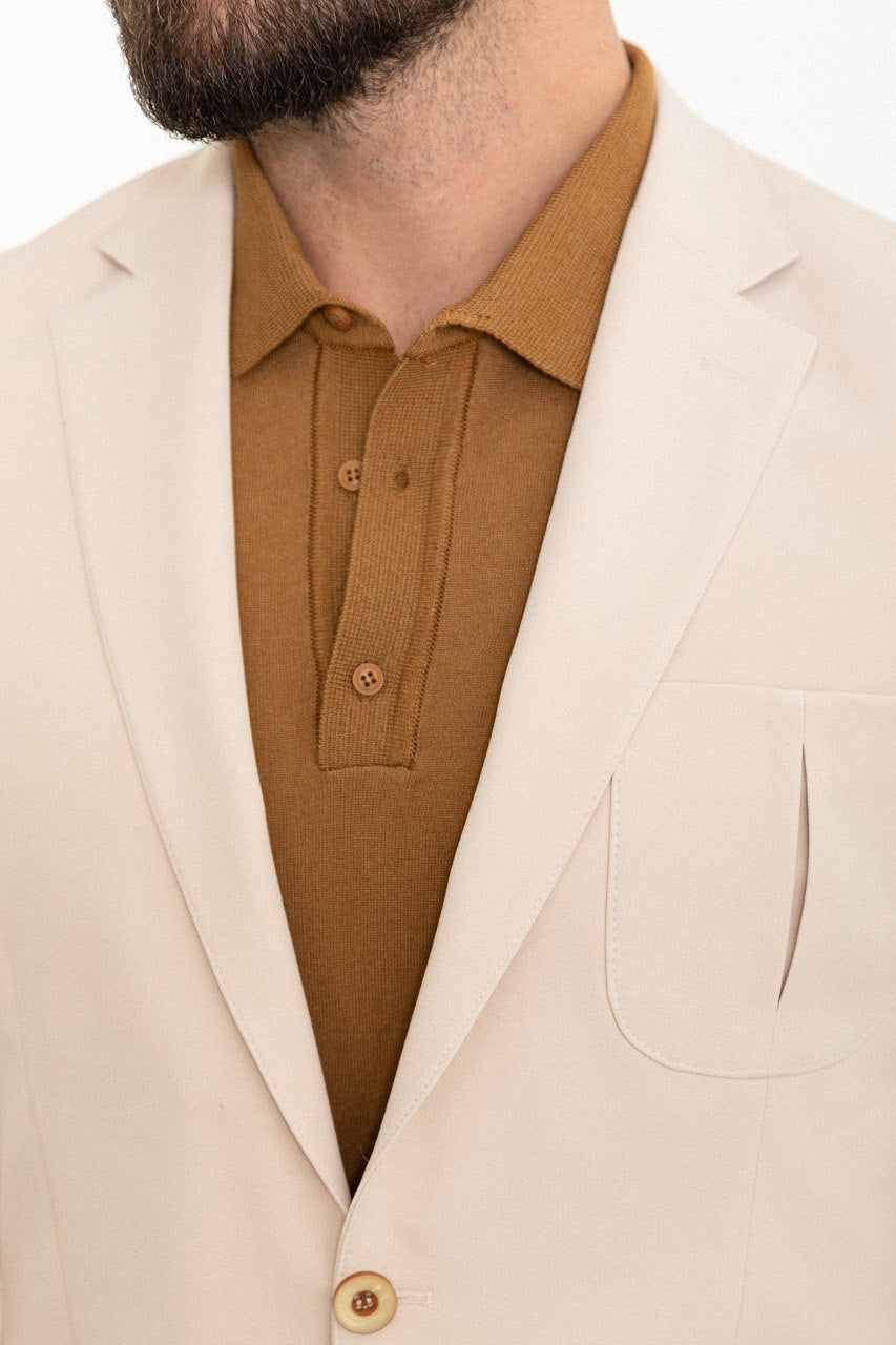 Man wearing the Urban Elegance Beige Suit, a slim fit beige suit with extra pockets, suitable for casual and semi-formal occasions.