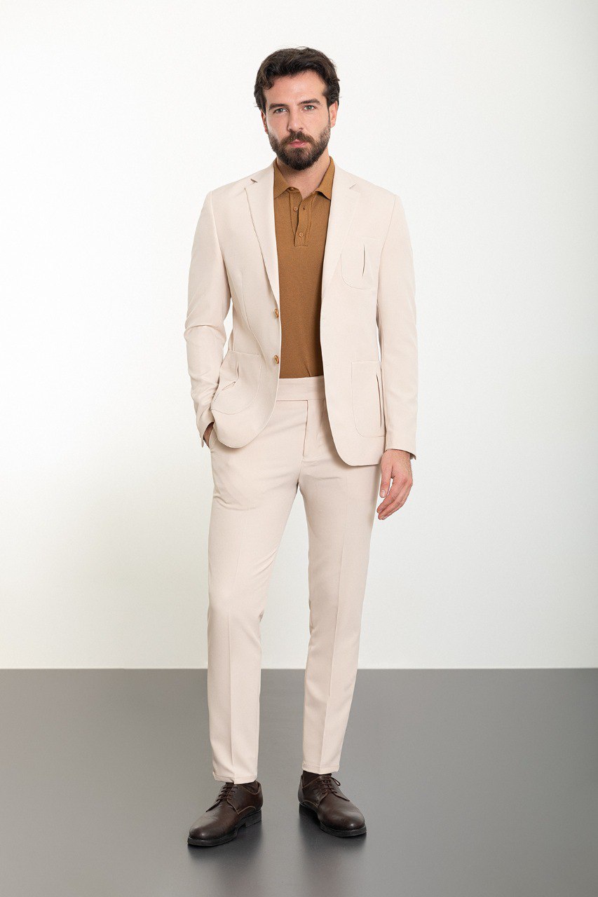 Man wearing the Urban Elegance Beige Suit, a slim fit beige suit with extra pockets, suitable for casual and semi-formal occasions.