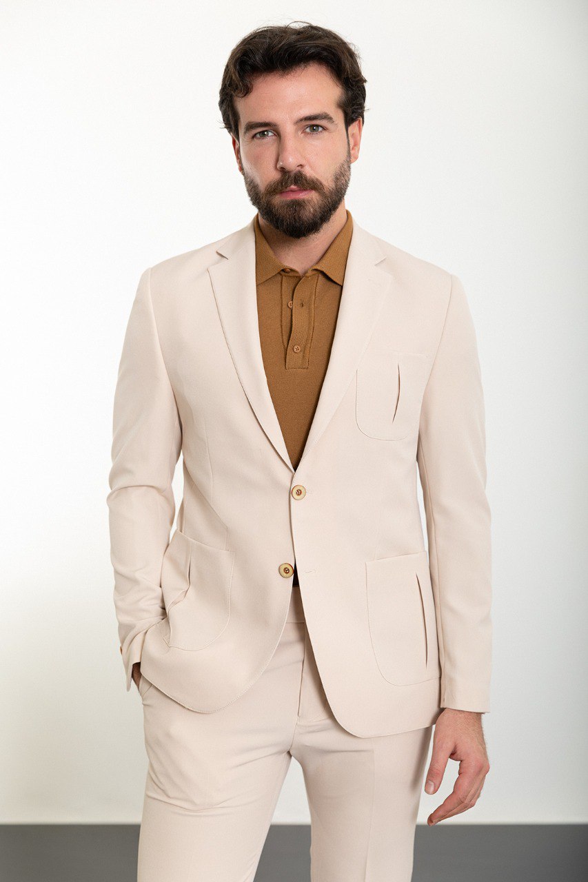 Man wearing the Urban Elegance Beige Suit, a slim fit beige suit with extra pockets, suitable for casual and semi-formal occasions.