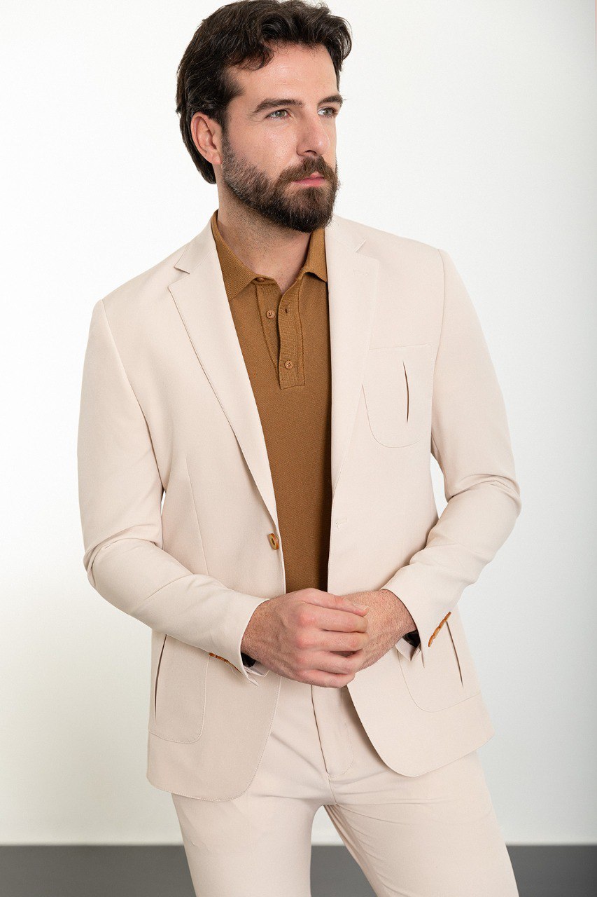 Man wearing the Urban Elegance Beige Suit, a slim fit beige suit with extra pockets, suitable for casual and semi-formal occasions.