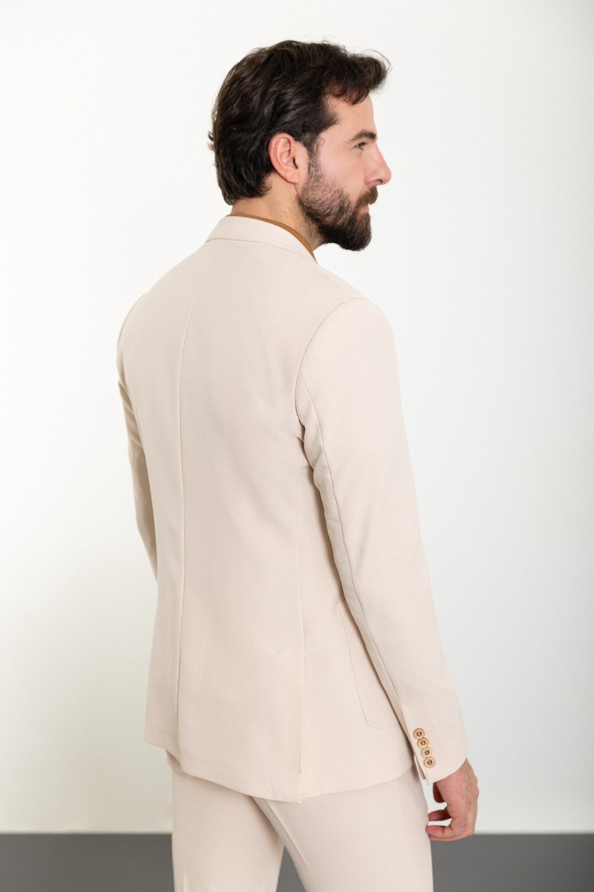 Man wearing the Urban Elegance Beige Suit, a slim fit beige suit with extra pockets, suitable for casual and semi-formal occasions.