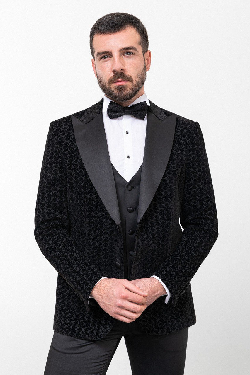 Man in a black double-breasted tuxedo with a bow tie.