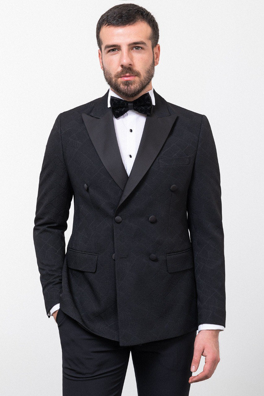 Man in a black double-breasted tuxedo with a bow tie.