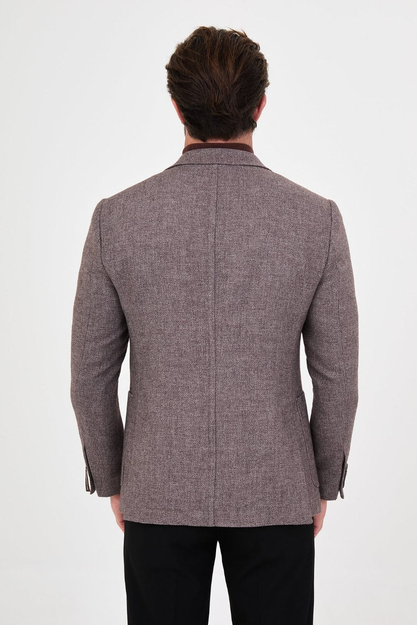 Back view of men’s beige blazer