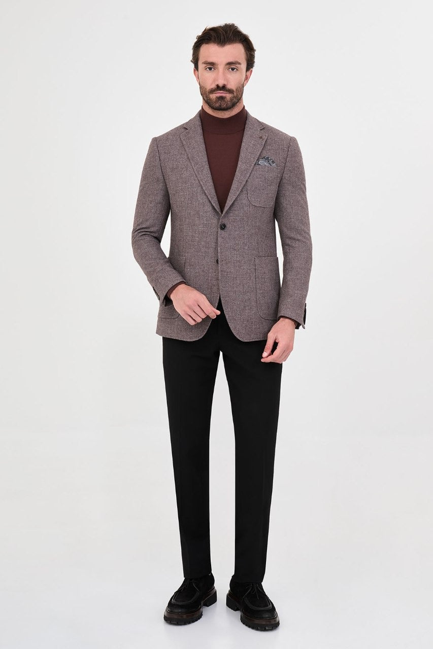 Men’s beige blazer styled with black trousers