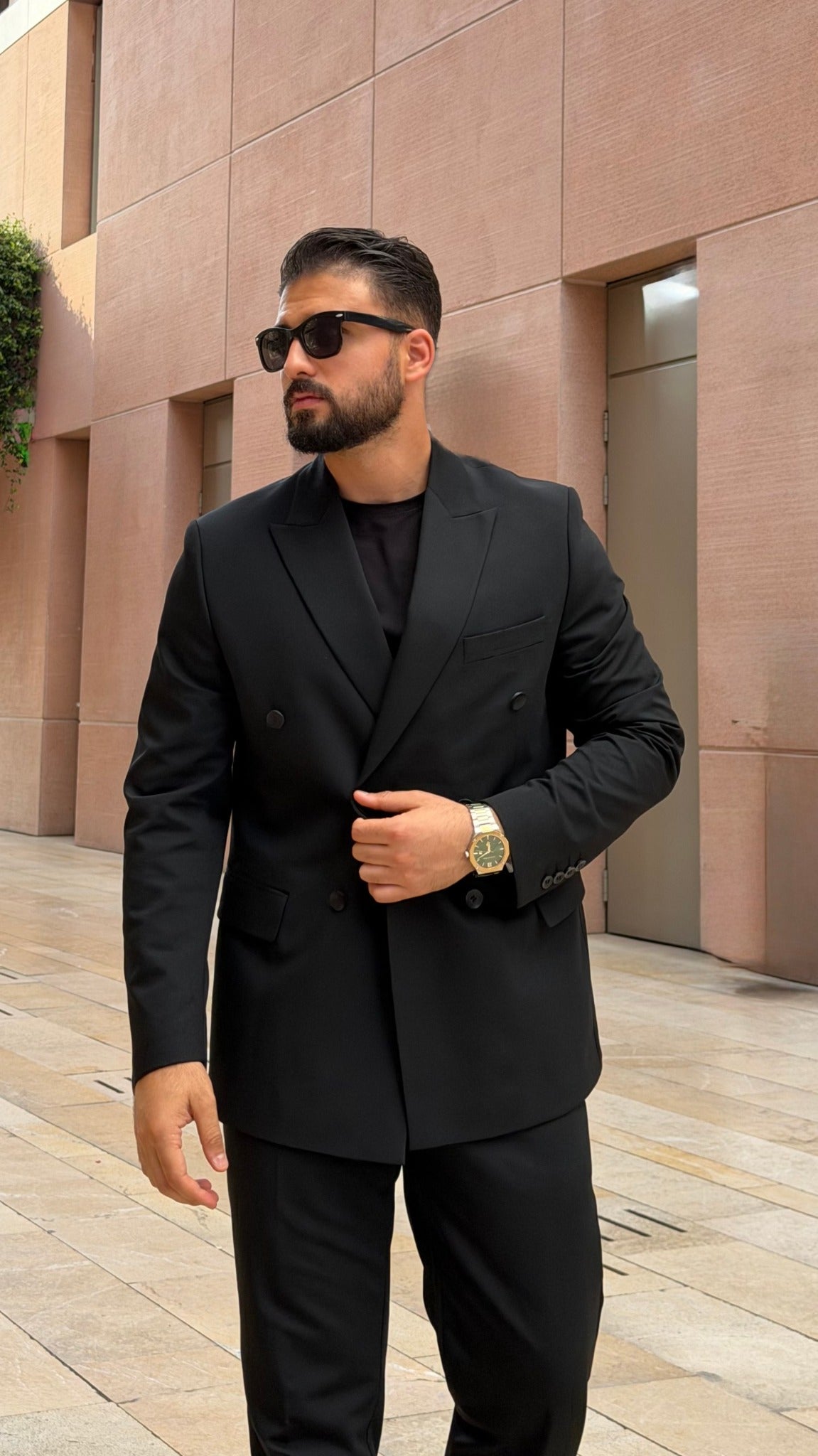 Men's black double-breasted two-piece suit mid-length view