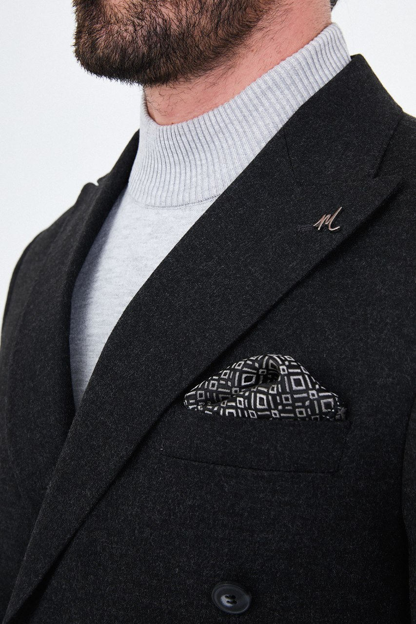 Men's black double-breasted two-piece suit lapel detail