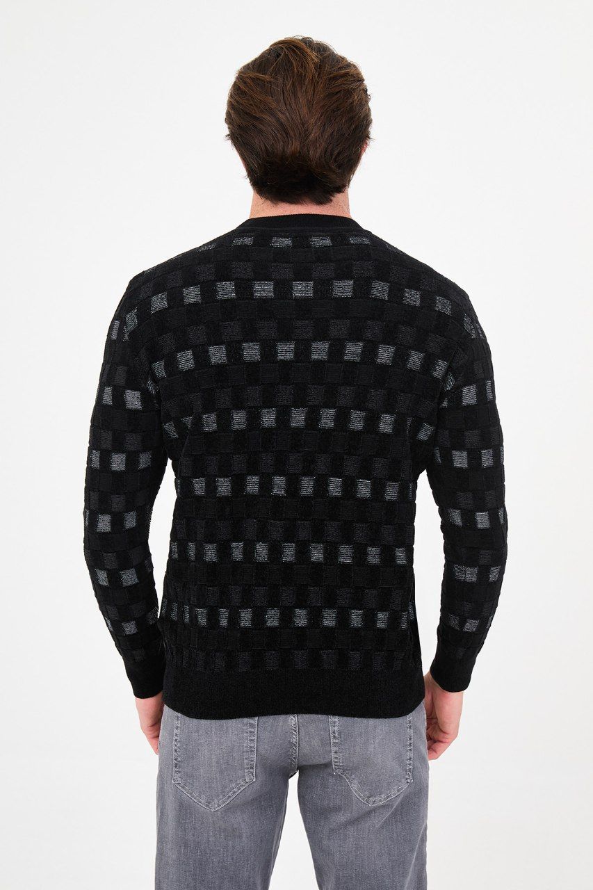 Back view of the men's black geometric patterned sweater