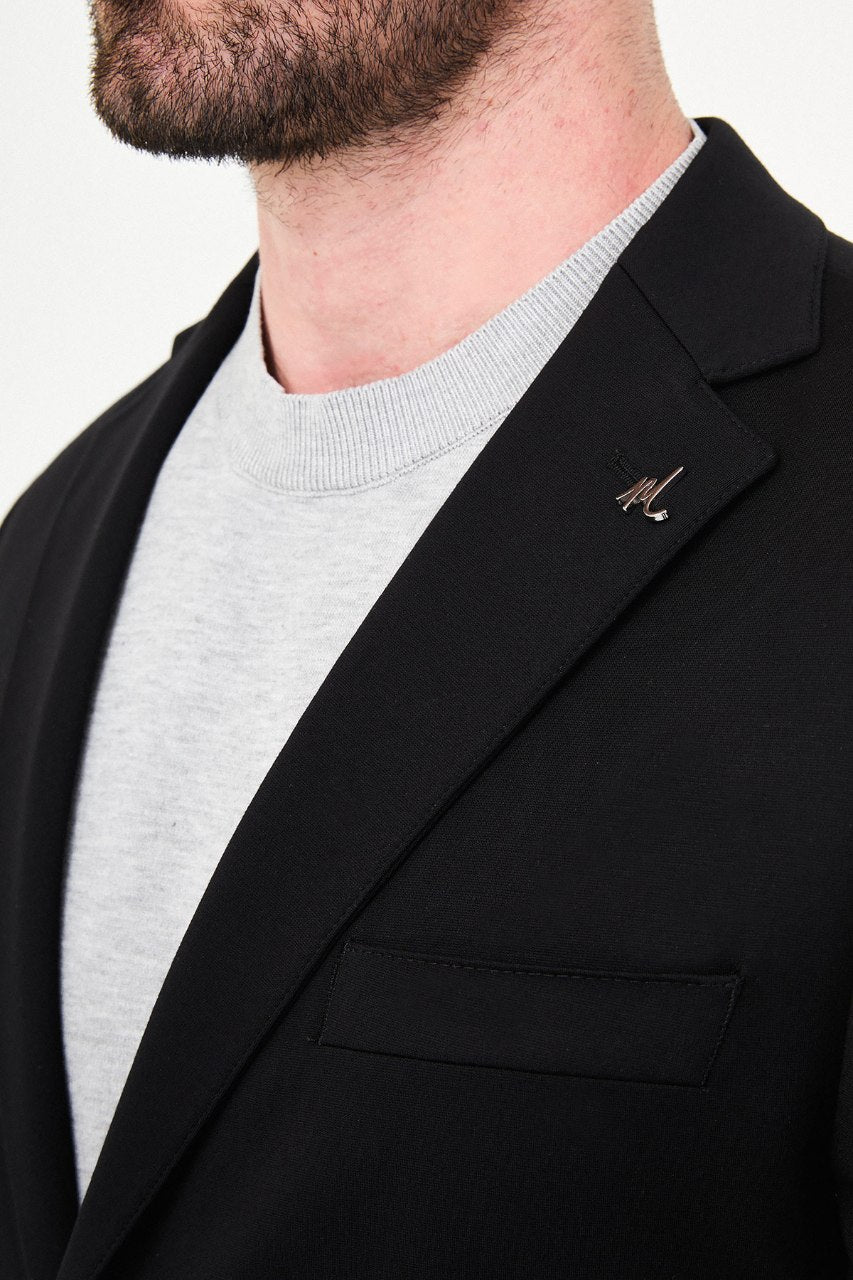 Men's black two-piece suit notch lapel close-up