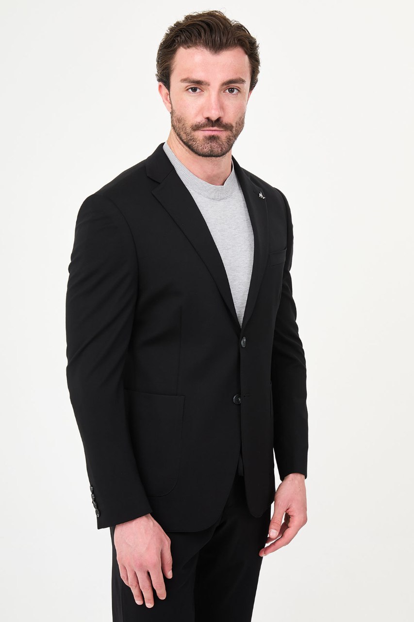Men's black two-piece suit side styled view