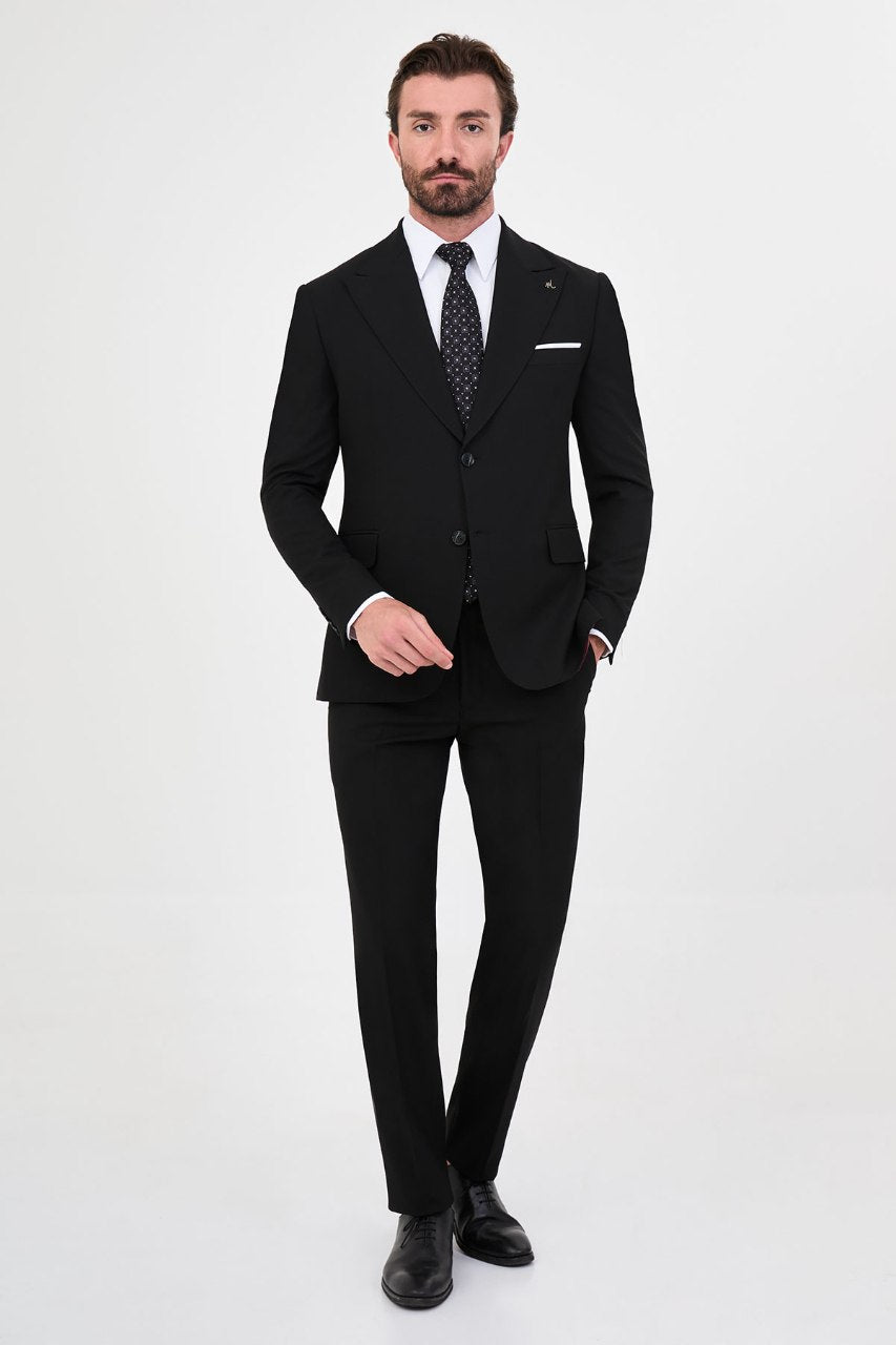 Men's black slim-fit two-piece suit full-length view