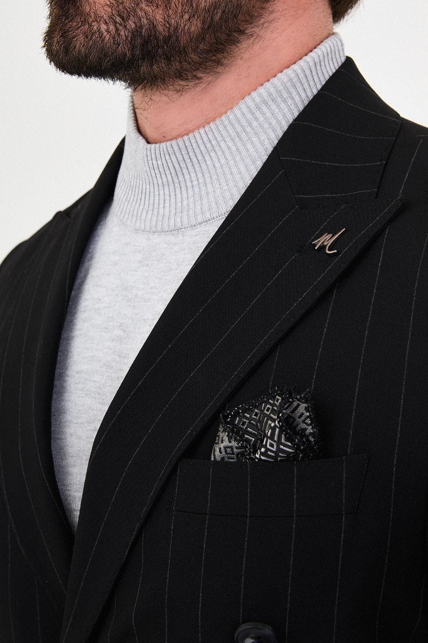 Men's black pinstripe double-breasted suit lapel and pinstripe detail