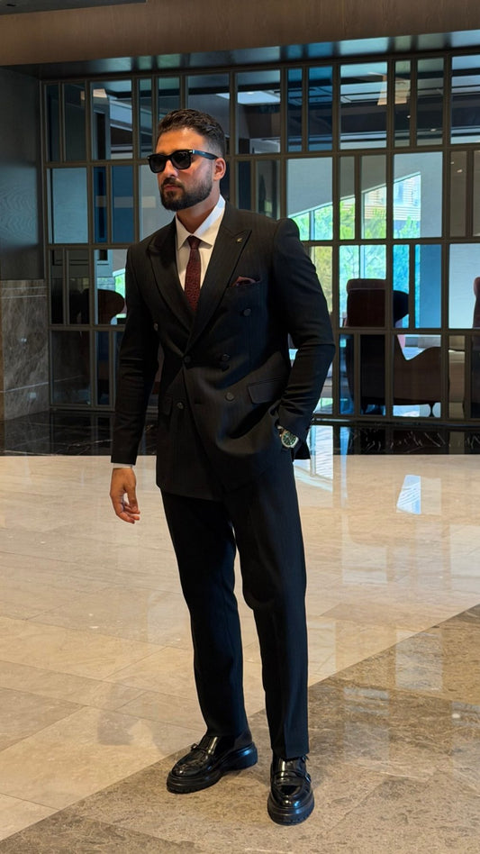Men's black pinstripe double-breasted suit full-length formal look