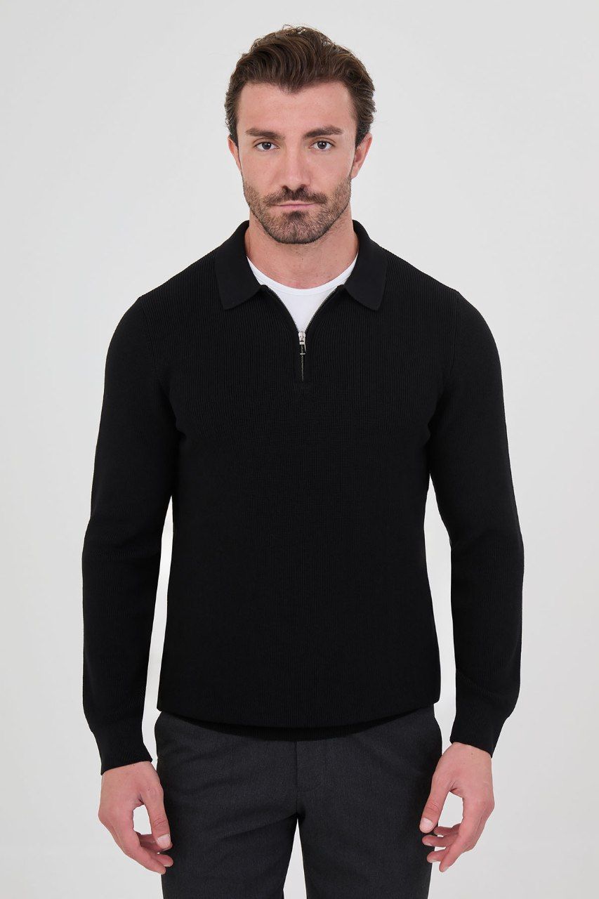 Front view of a man wearing a black ribbed zip-polo sweater