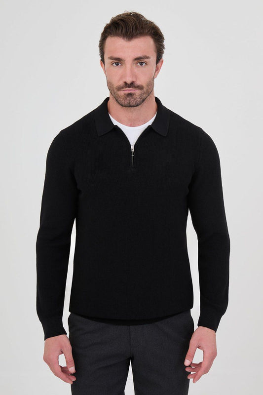 Front view of a man wearing a black ribbed zip-polo sweater