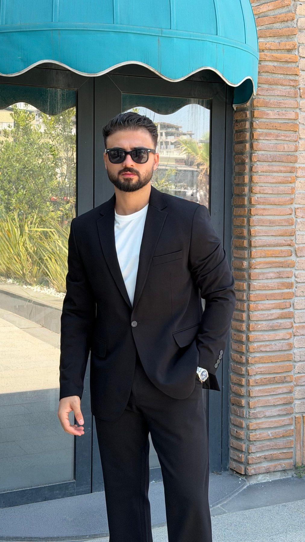 Men's black single-breasted suit front view
