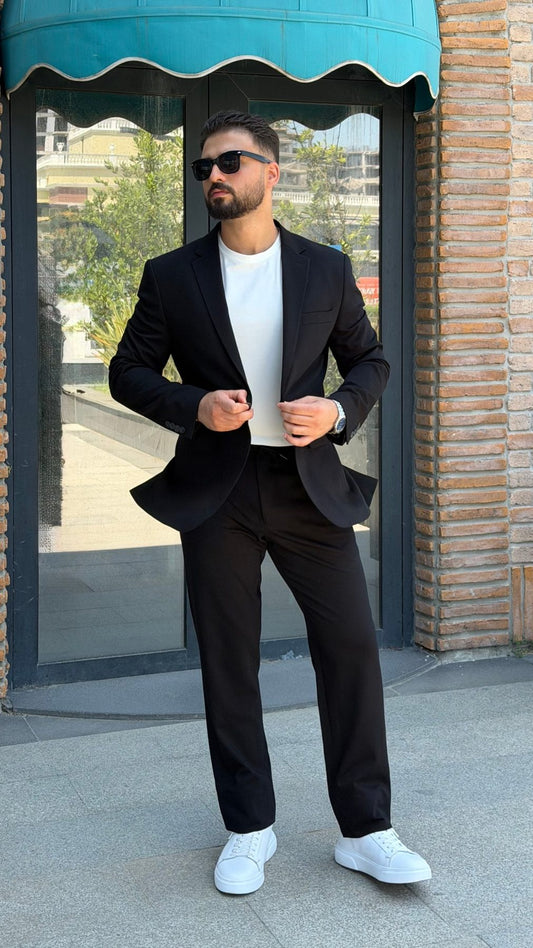 Men's black single-breasted two-piece suit full-length view