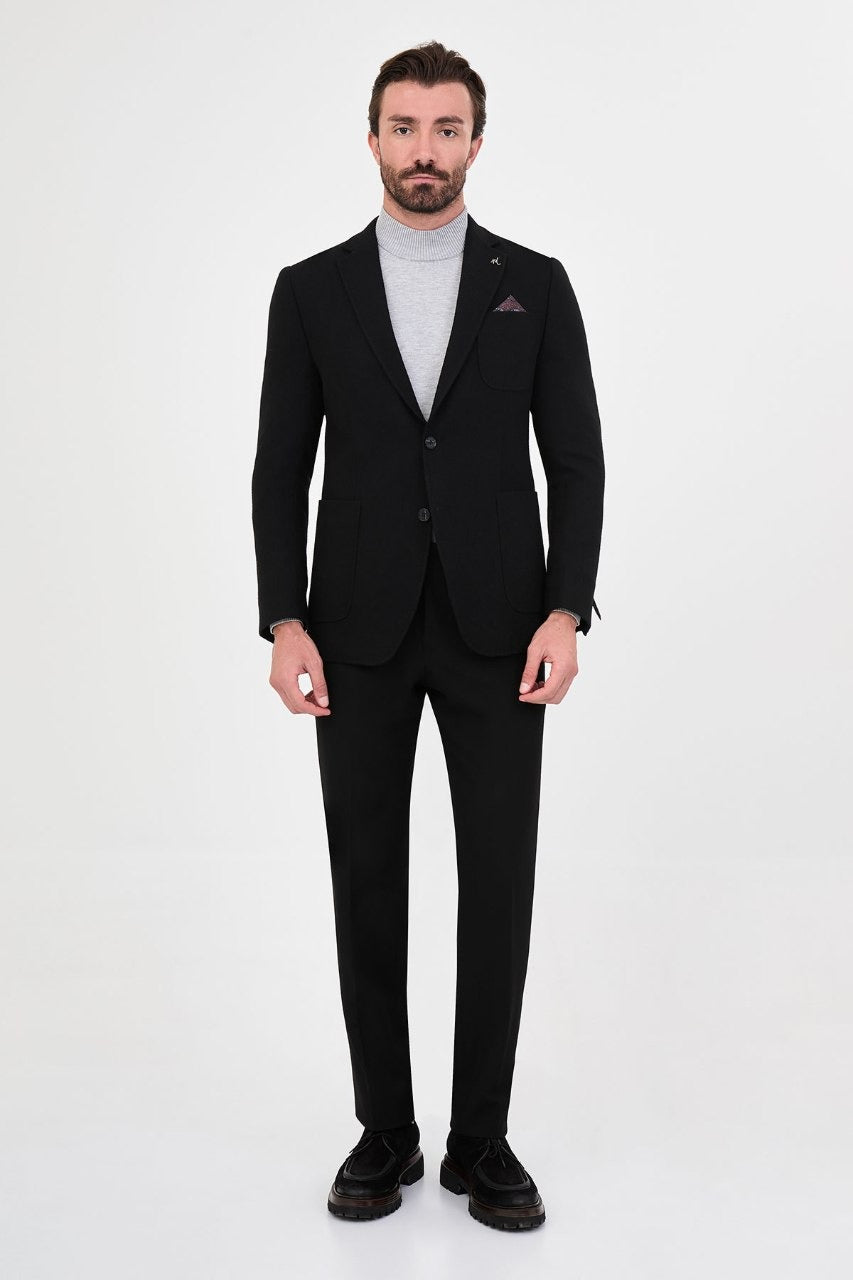 Men’s black blazer styled with black trousers