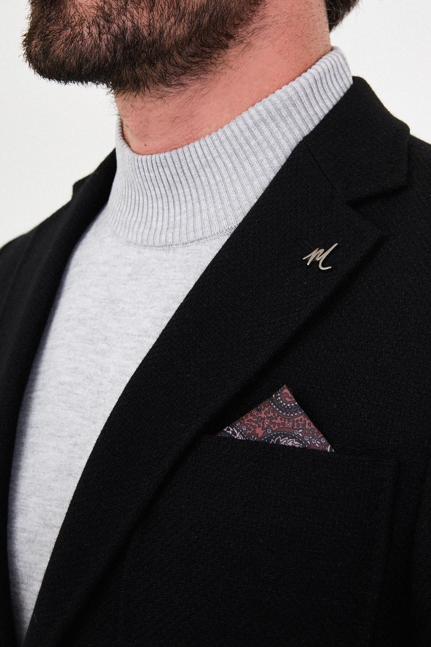 Notch lapel and chest pocket on black blazer