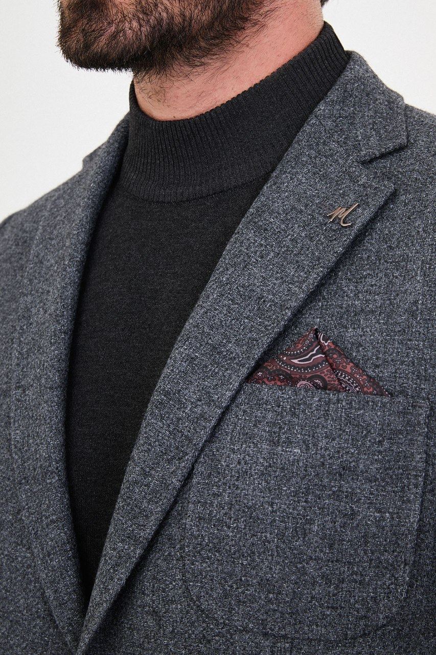 Notch lapel and chest pocket on blue grey blazer