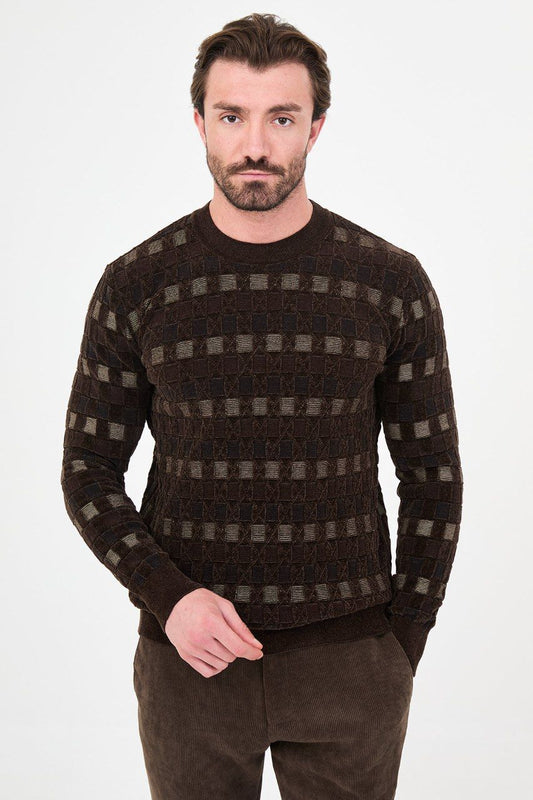 Front view of a man wearing a brown geometric knit crew neck sweater