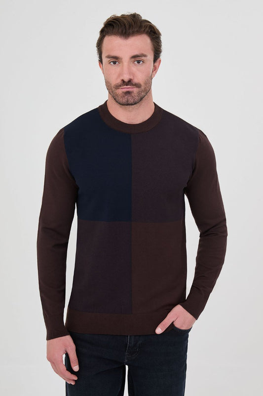Front view of a man wearing a brown and navy blue colour-block crew neck sweater