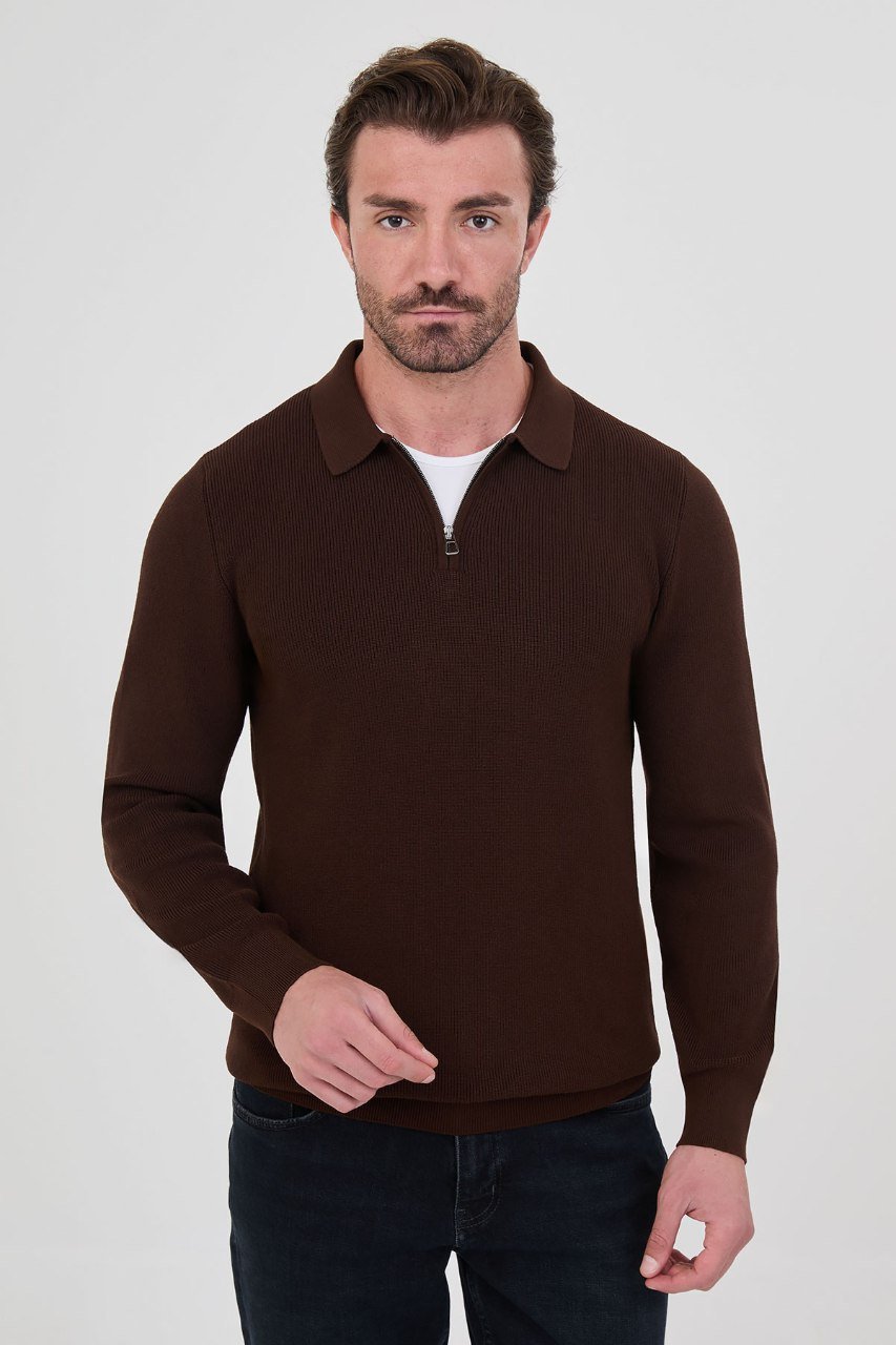 Front view of a man wearing a brown ribbed quarter-zip polo sweater