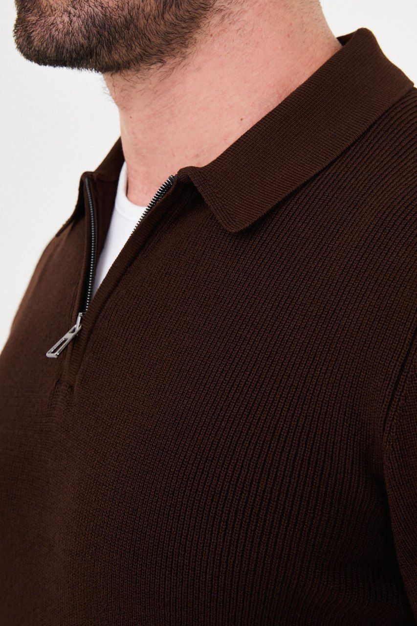 Close-up of the brown sweater's ribbed knit, polo collar and quarter-zip fastening