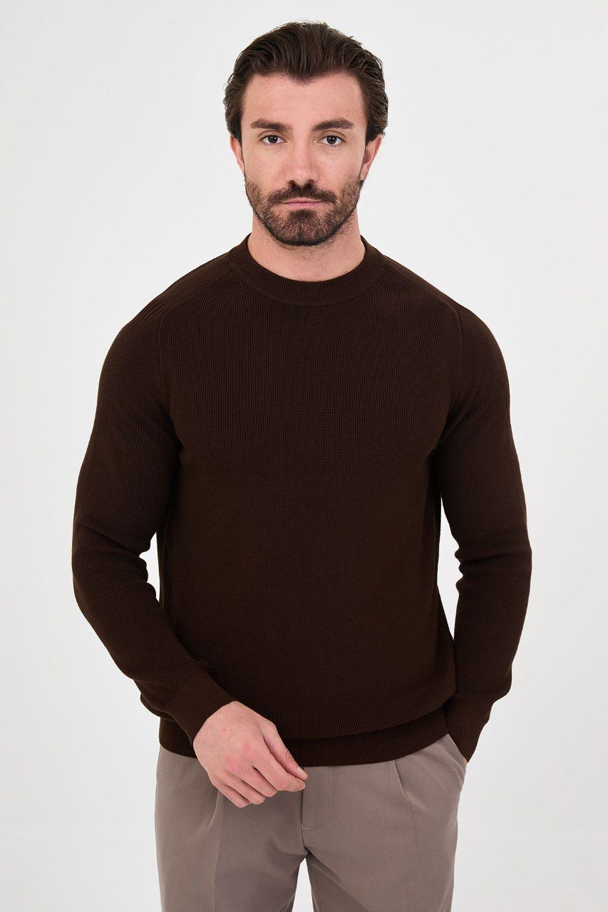 Front view of a man wearing a brown ribbed raglan crew neck sweater
